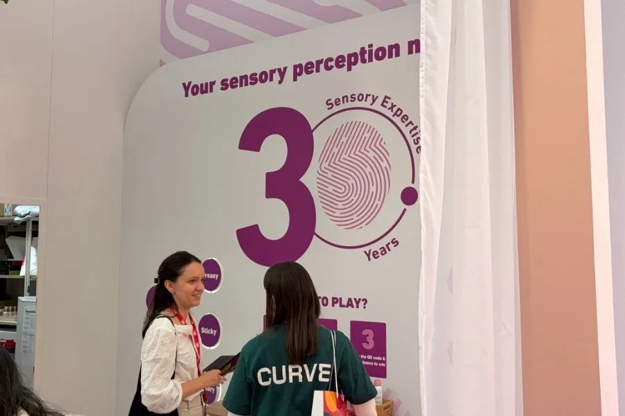 People at In-cosmetics Global 2026 looking at the Gattefossé exhibit